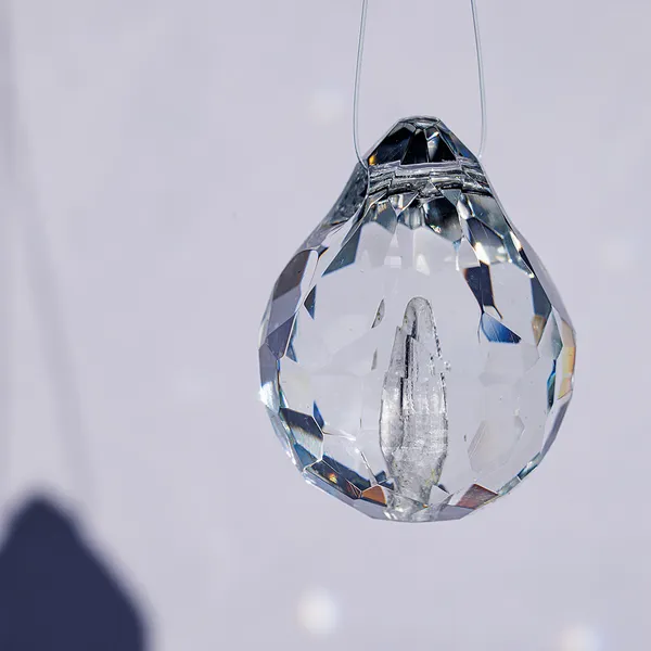 Single faceted glass teardrop pendant