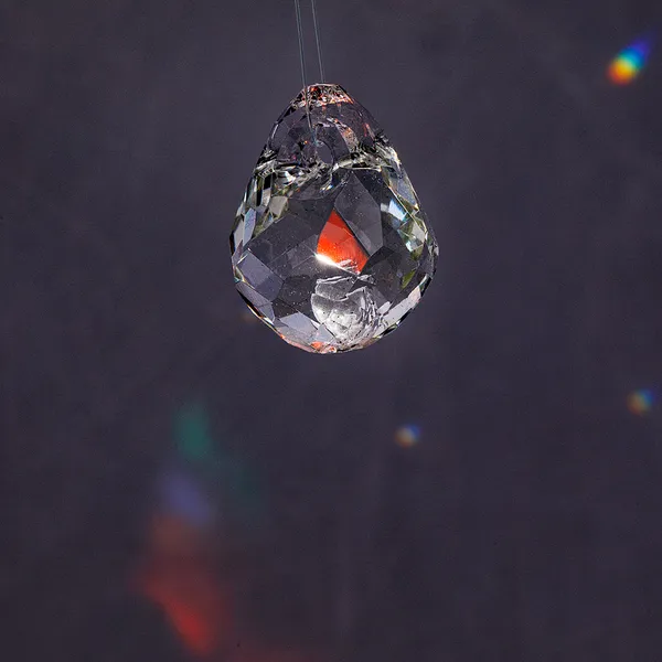 Glass teardrop pendant with intense color refraction