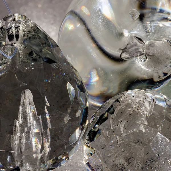 Two solid glass memorial paperweights