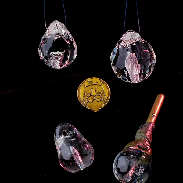 Group of glass memorial pendants with gold signature coin