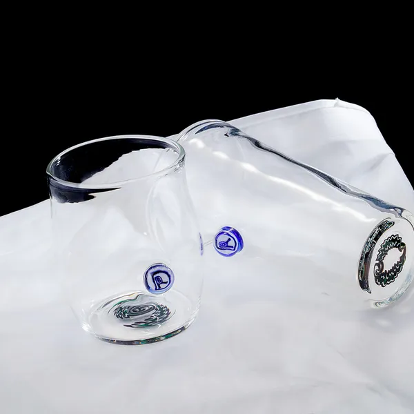 Set of hand-blown glass tumblers showing base signatures
