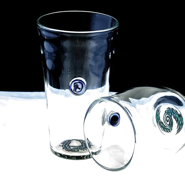 Set of hand-blown glass tumblers showing base signatures