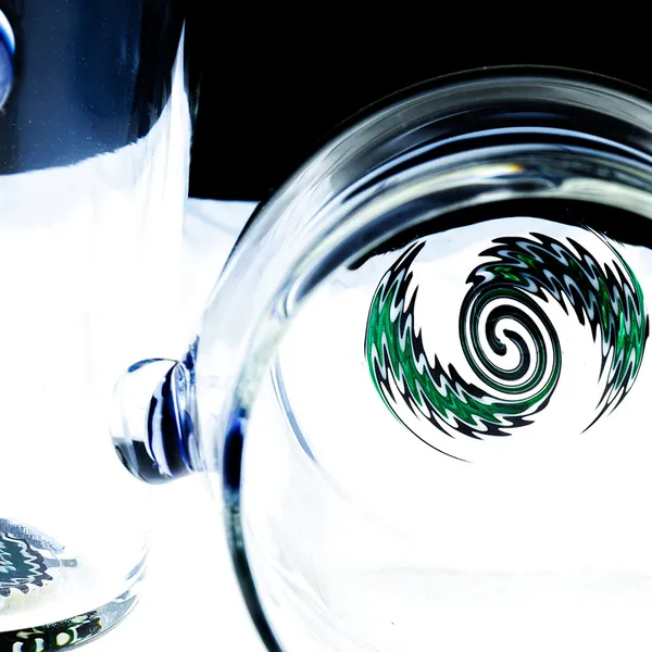 Set of hand-blown glass tumblers showing base signatures